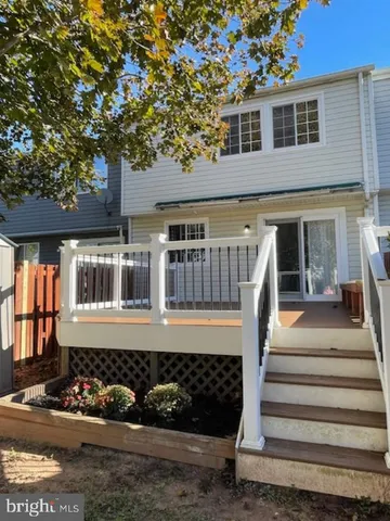 a house that has a tree in front of it