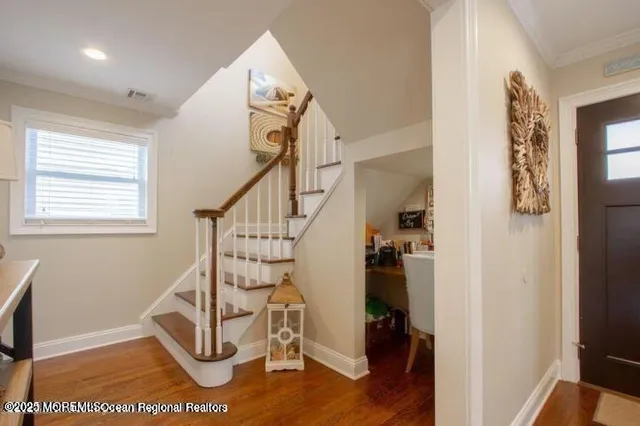 a view of entryway with wooden floor