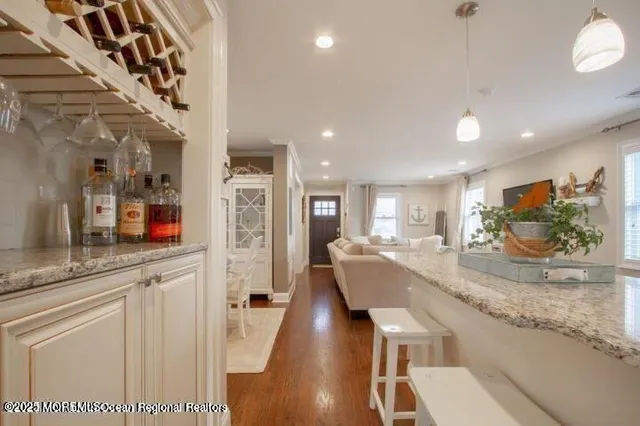 a large kitchen with stainless steel appliances granite countertop a large island in the center