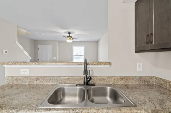 a bathroom with a sink and mirror