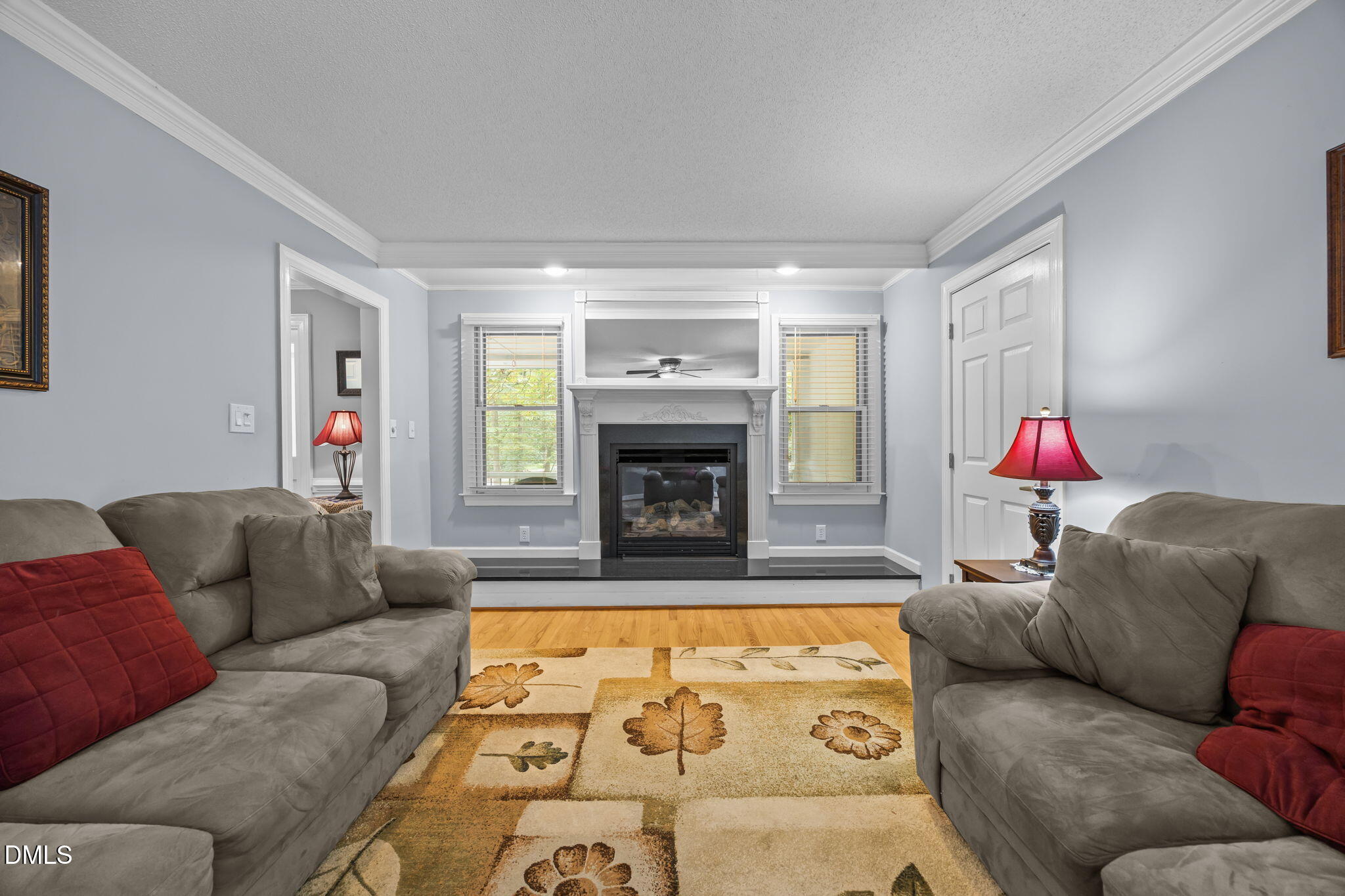 8641 Buffaloe Road Knightdale, NC 27545 - Photo 14 of 52 a living room with furniture and a fireplace