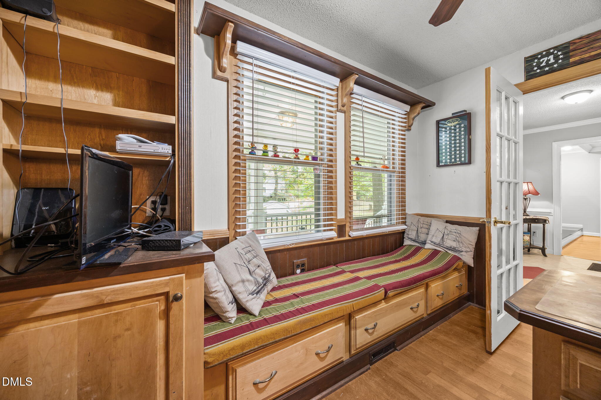 8641 Buffaloe Road Knightdale, NC 27545 - Photo 17 of 52 a living room with furniture a flat screen tv and a window