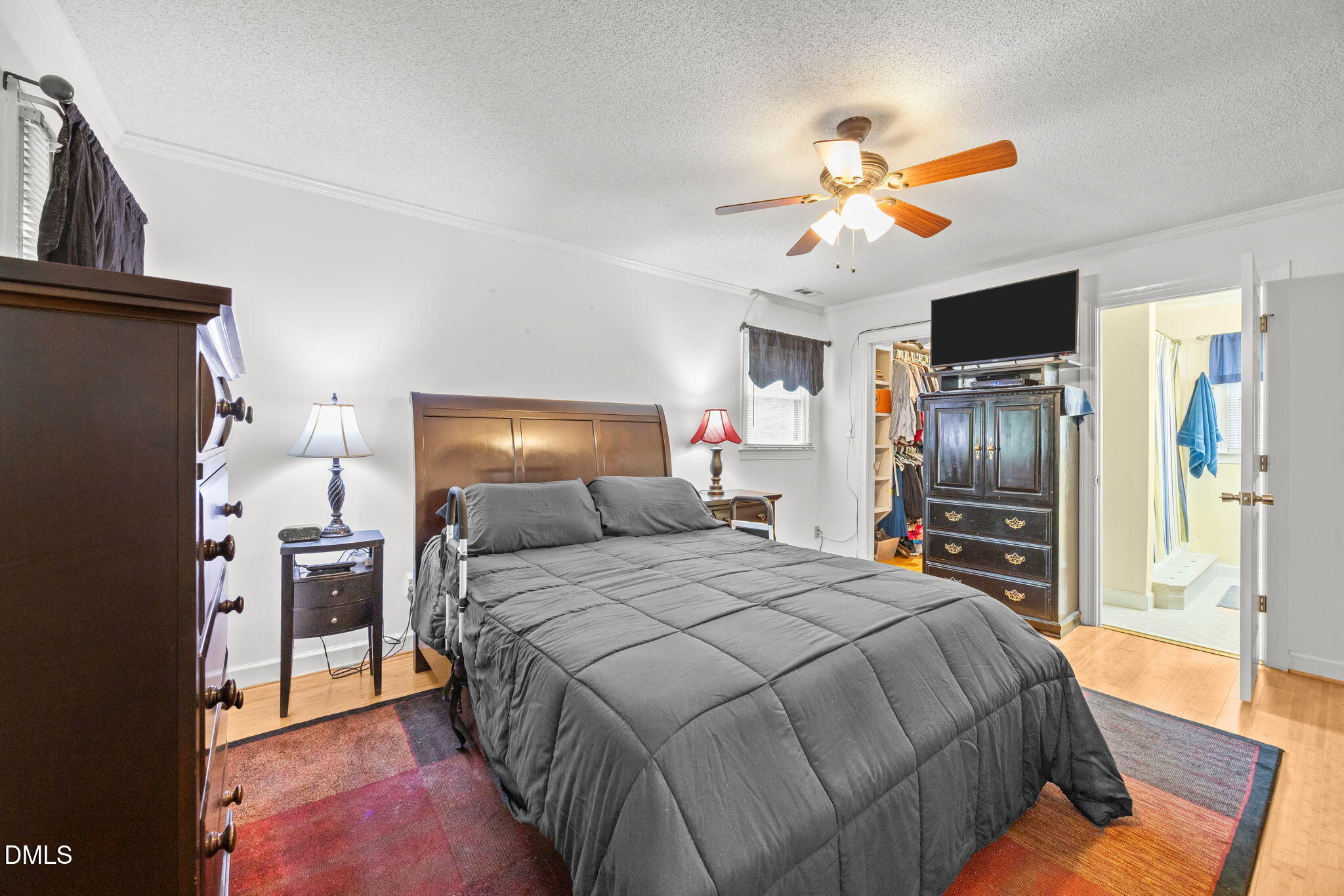 8641 Buffaloe Road Knightdale, NC 27545 - Photo 23 of 52 a bedroom with a bed and a television