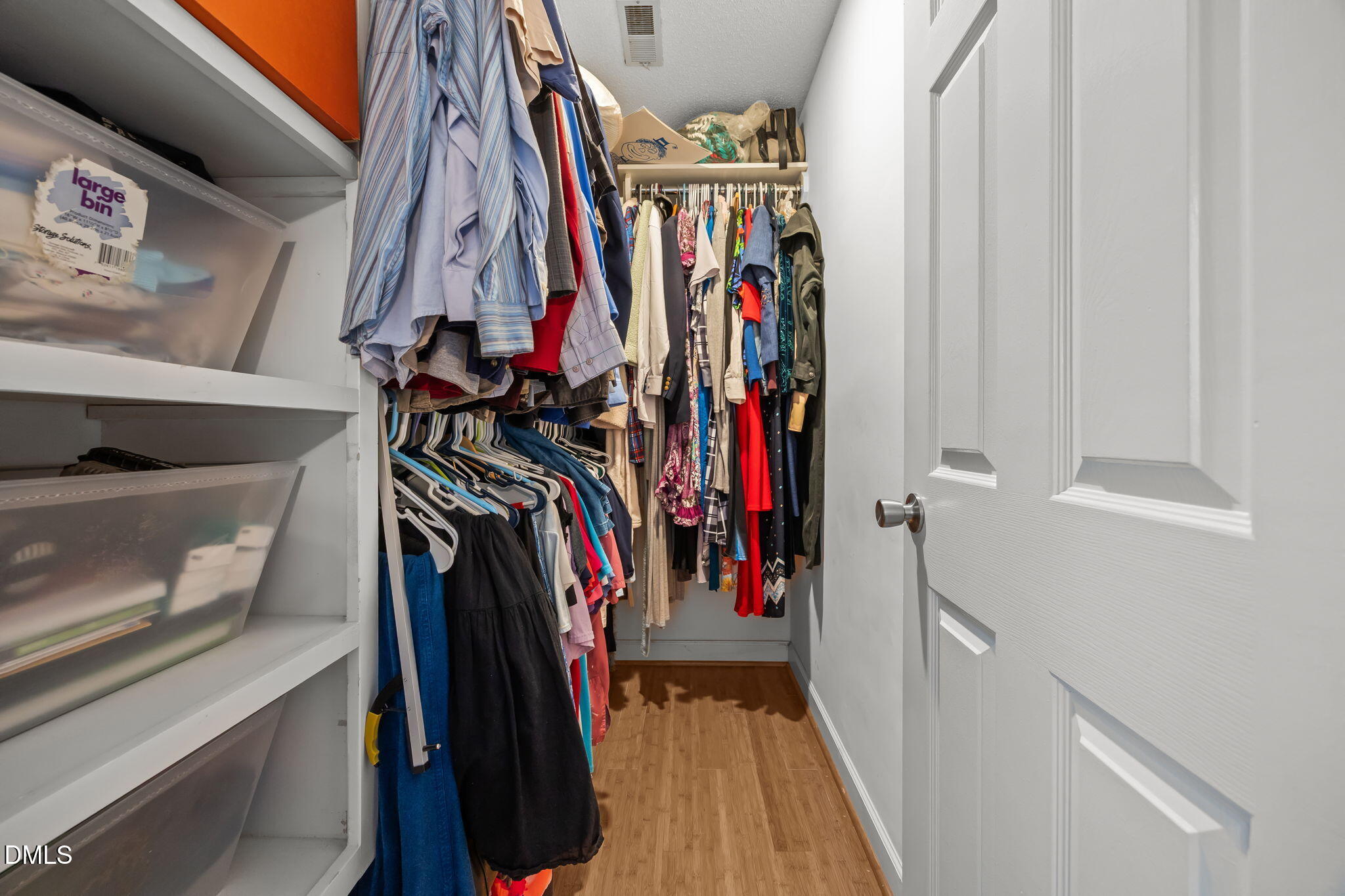 8641 Buffaloe Road Knightdale, NC 27545 - Photo 25 of 52 a view of walk in closet with clothes