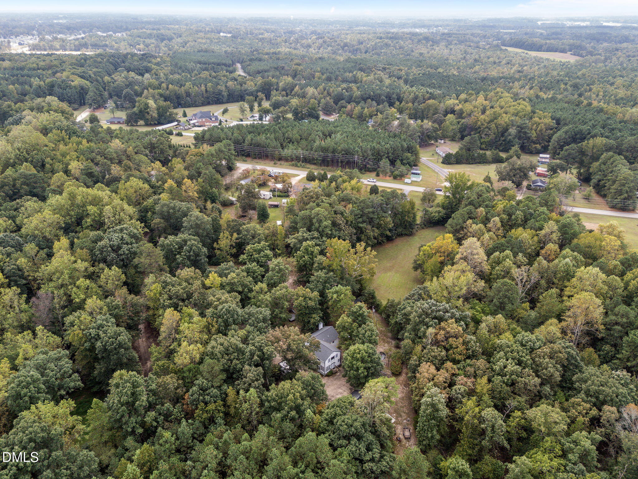 8641 Buffaloe Road Knightdale, NC 27545 - Photo 44 of 52 an aerial view of residential house with parking and trees