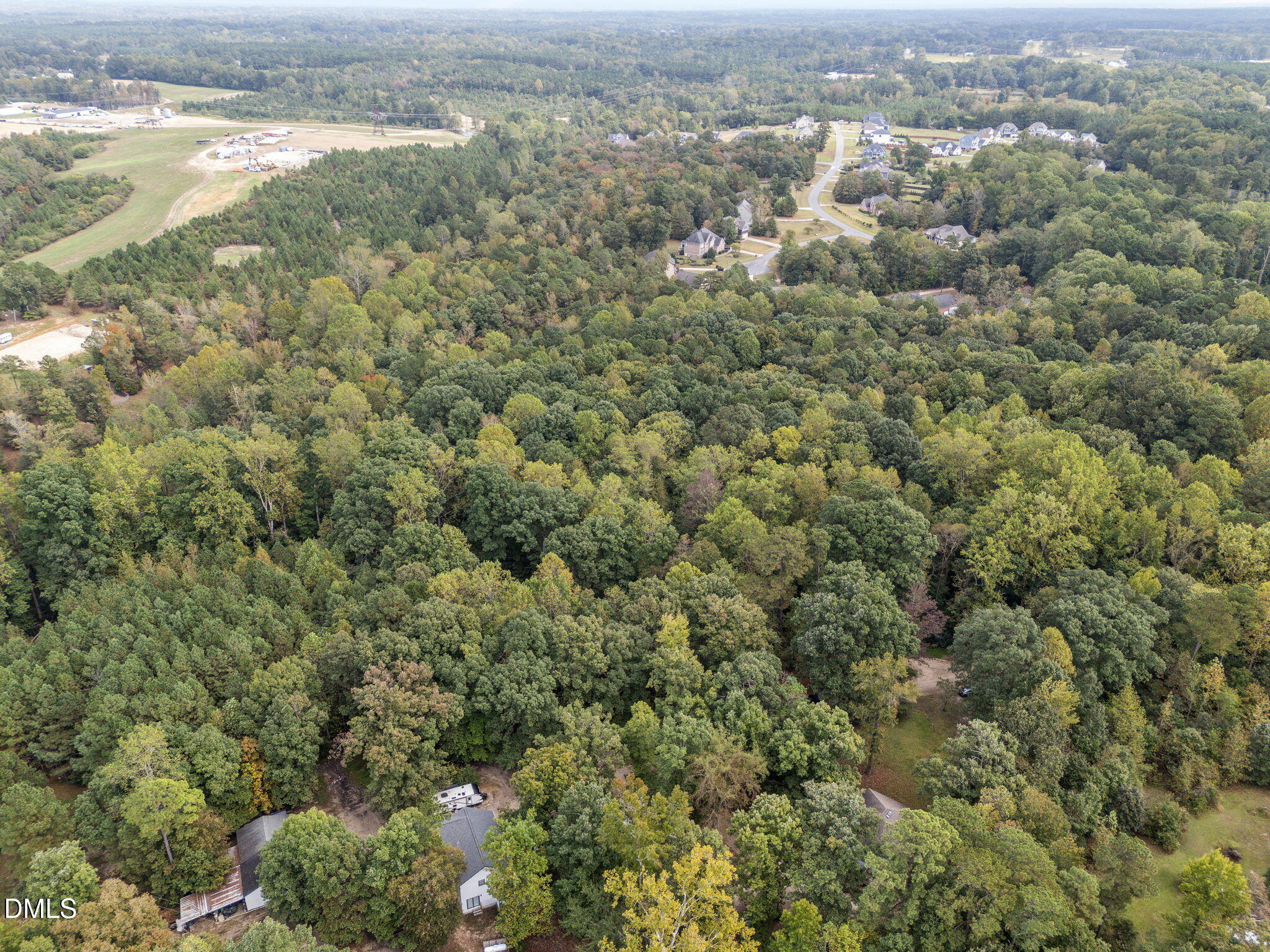8641 Buffaloe Road Knightdale, NC 27545 - Photo 45 of 52 an aerial view of residential houses with outdoor space and trees