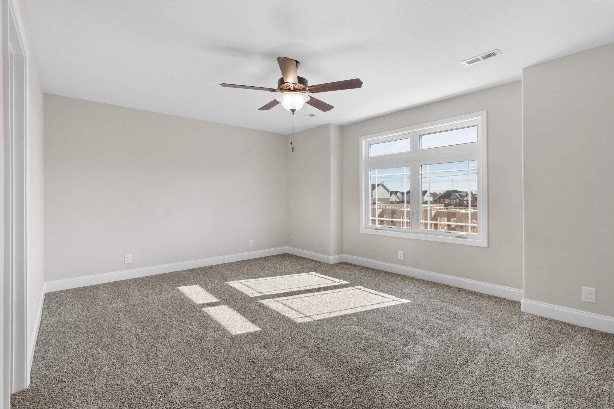 206 Fallow Drive Clarksville, TN 37040 - Photo 13 of 28 an empty room with windows and fan