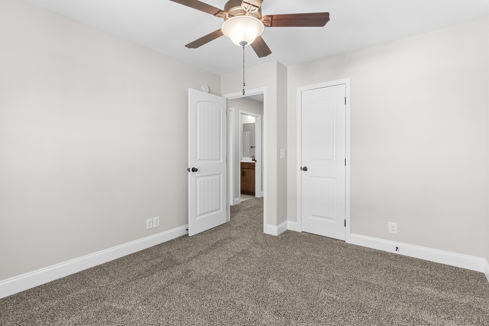206 Fallow Drive Clarksville, TN 37040 - Photo 20 of 28 an empty room with a ceiling fan and a window