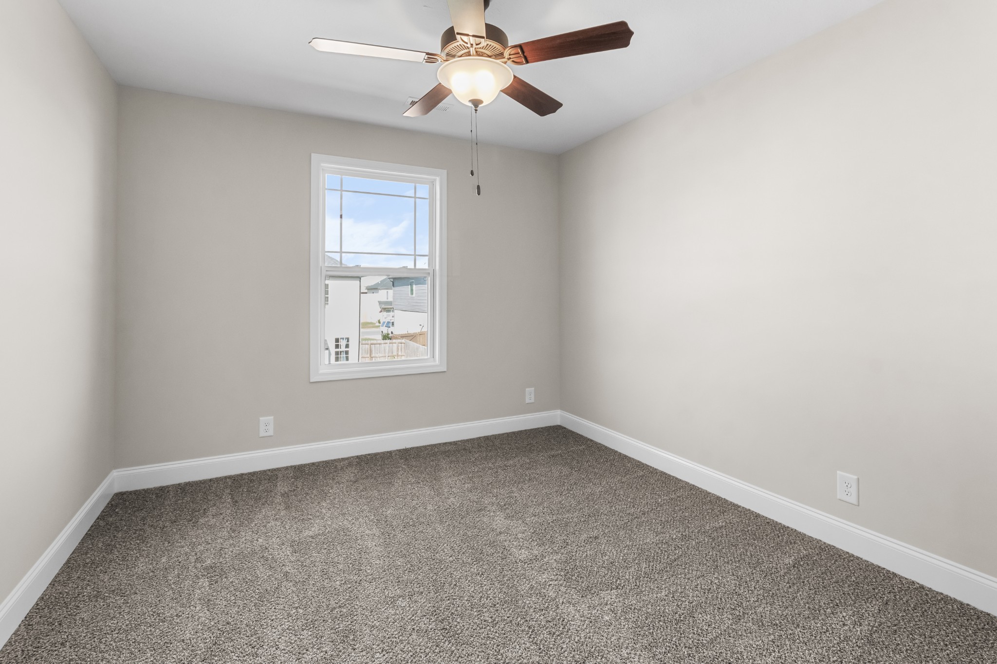206 Fallow Drive Clarksville, TN 37040 - Photo 21 of 28 an empty room with windows and fan