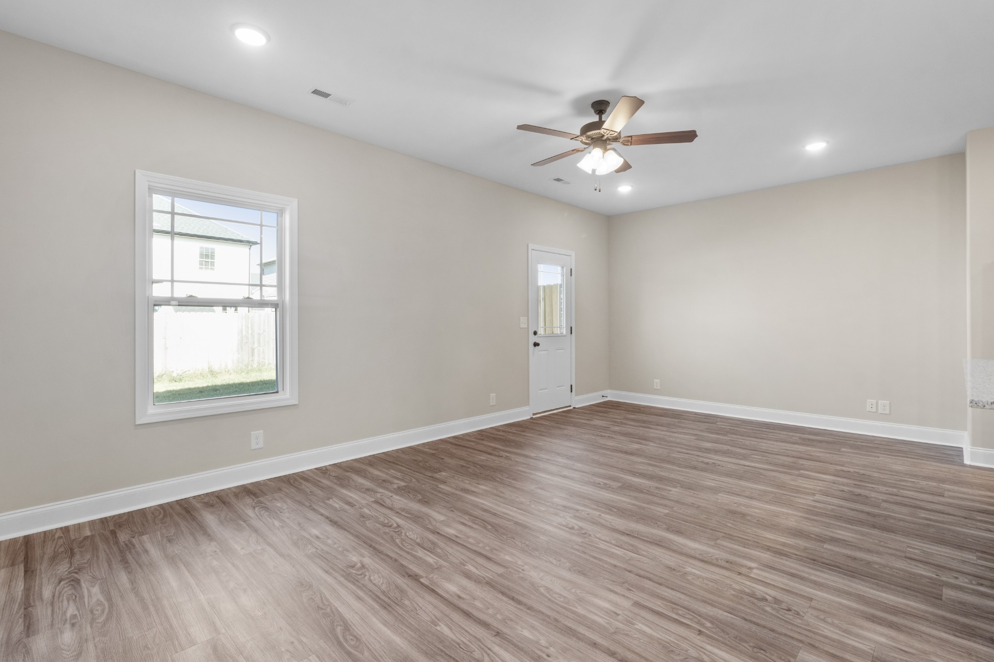 206 Fallow Drive Clarksville, TN 37040 - Photo 3 of 28 a view of an empty room with wooden floor and a window