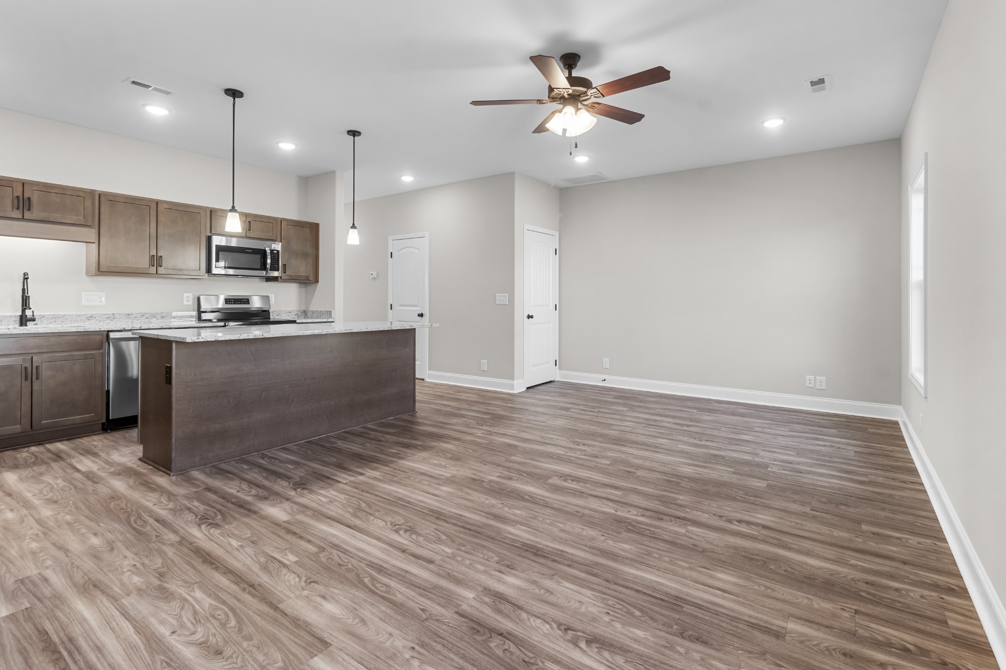 206 Fallow Drive Clarksville, TN 37040 - Photo 6 of 28 a kitchen with stainless steel appliances granite countertop a sink a stove and a refrigerator