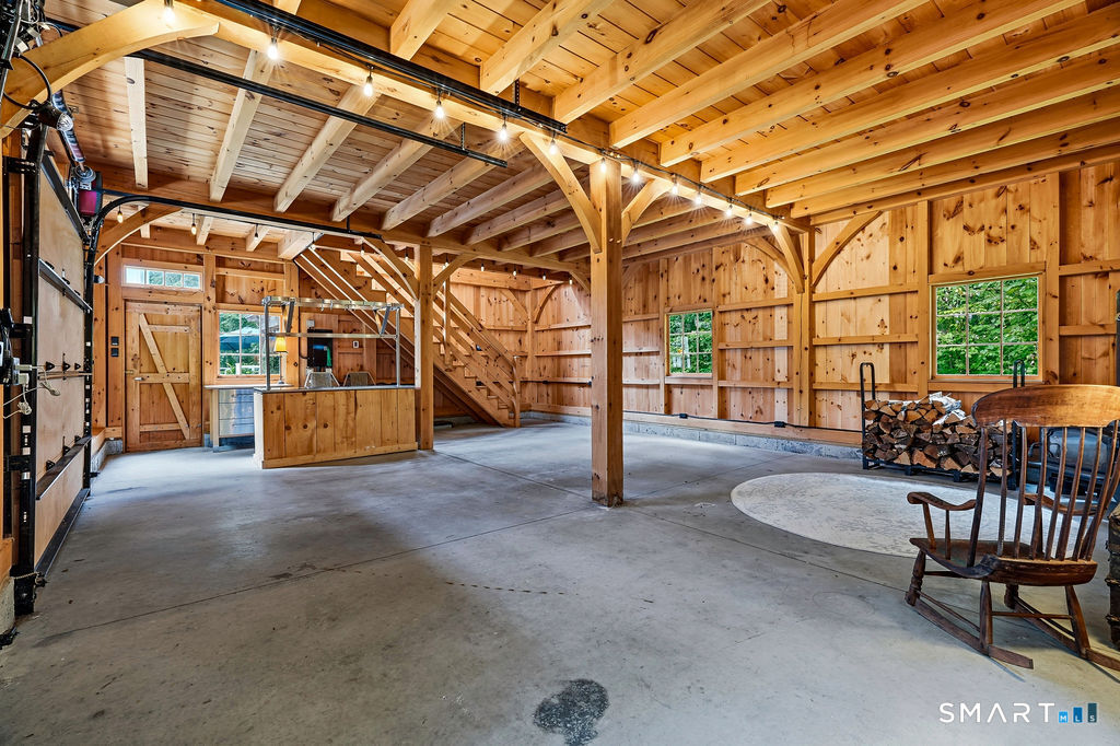 17 Florida Road East Haddam, CT 06423 - Photo 23 of 40 Beautifully crafted with traditional mortise-and-tenon joinery, this striking post-and-beam barn is as impressive as it is versatile-ideal for entertaining, a studio, workshop, car collection or hobbies, with EV-charging port.