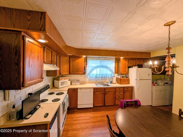a kitchen with a stove and a refrigerator