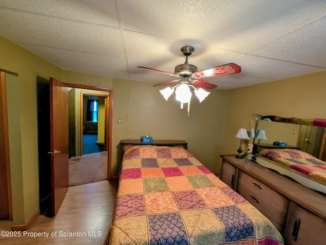 a bedroom with a bed and a closet