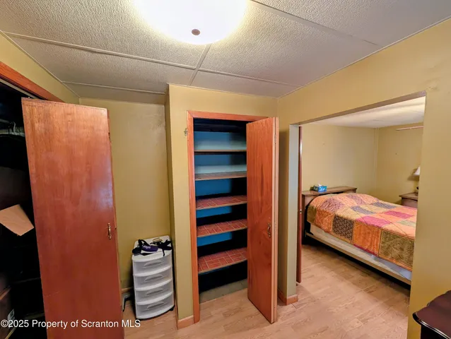 a bedroom with a bed and a closet