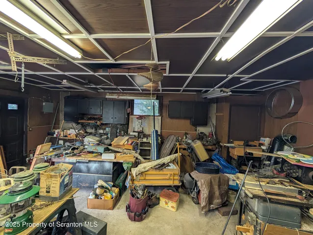 a view of a house with a wooden deck