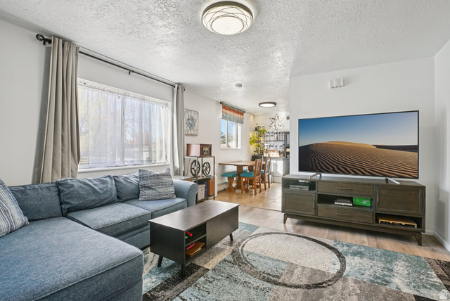 645 Swenson Avenue, Unit 3 Springville, UT 84663 - Photo 2 of 9 Living room featuring light wood-type flooring and a textured ceiling