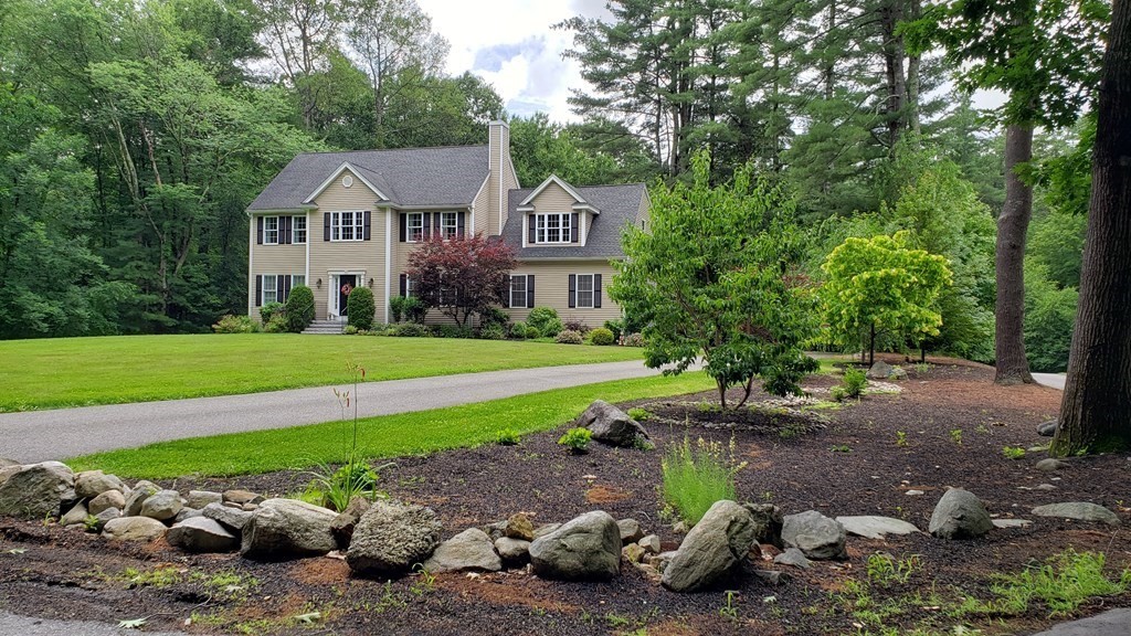 22 Randall Road Stow, MA 01775 - Photo 1 of 38 a front view of a house with garden
