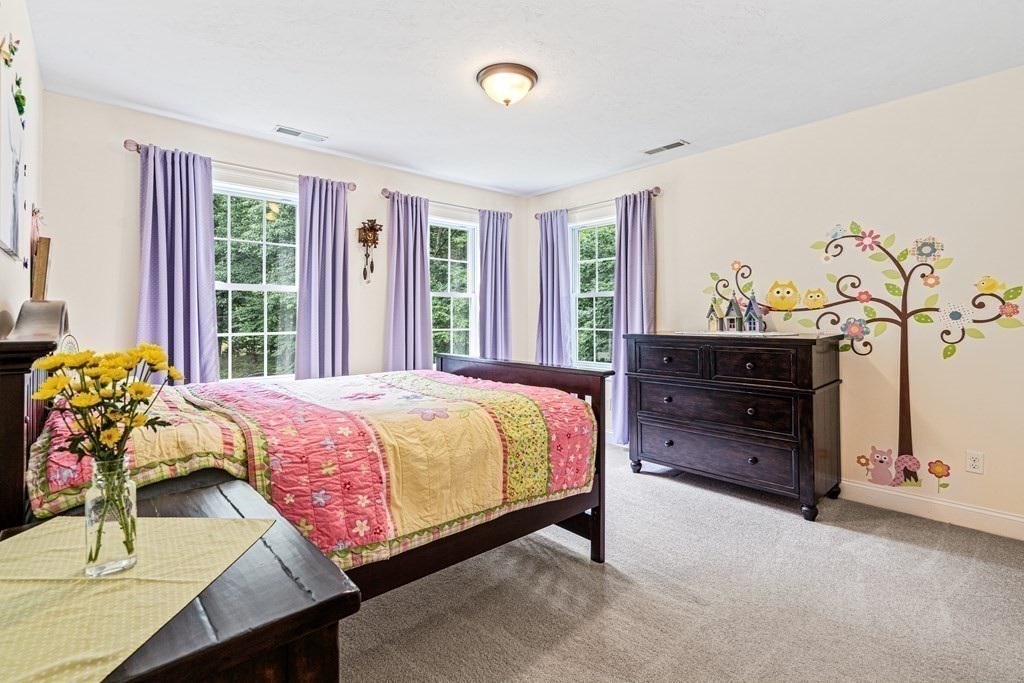 22 Randall Road Stow, MA 01775 - Photo 26 of 38 a bedroom with a bed and a window