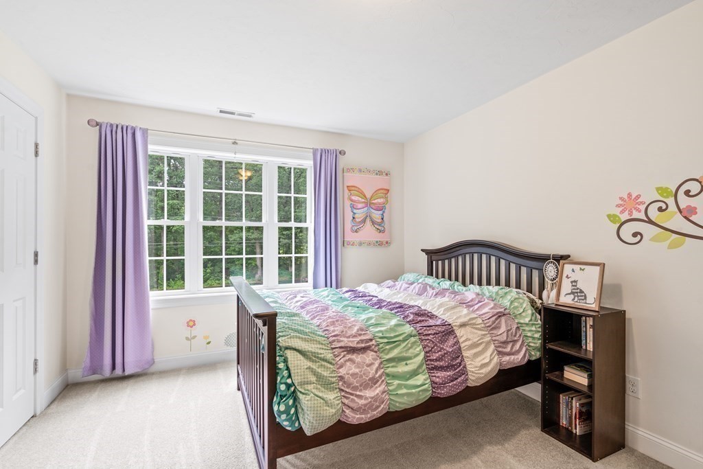 22 Randall Road Stow, MA 01775 - Photo 27 of 38 a bedroom with a bed and a window