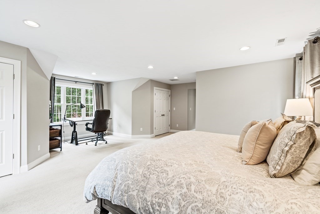 22 Randall Road Stow, MA 01775 - Photo 28 of 38 a bed room with a bed and a chair
