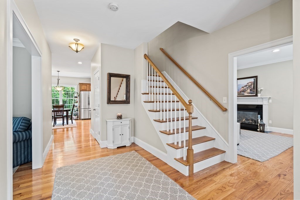 22 Randall Road Stow, MA 01775 - Photo 6 of 38 a view of entryway and hall with wooden floor