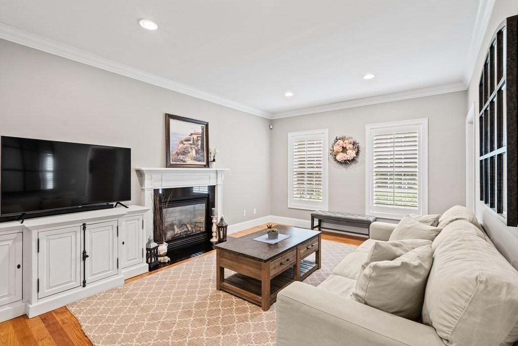 22 Randall Road Stow, MA 01775 - Photo 8 of 38 a living room with furniture and a flat screen tv