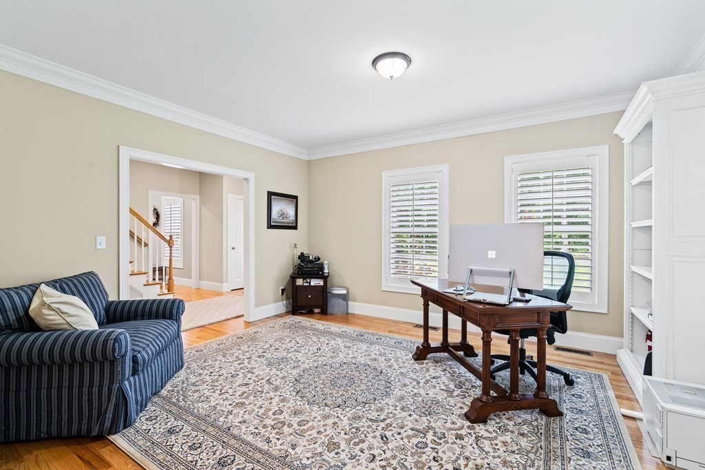 22 Randall Road Stow, MA 01775 - Photo 10 of 38 a living room with furniture and a window