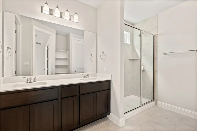 an empty room with closet and windows