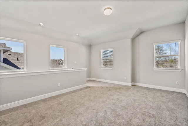 a view of a backyard with wooden fence