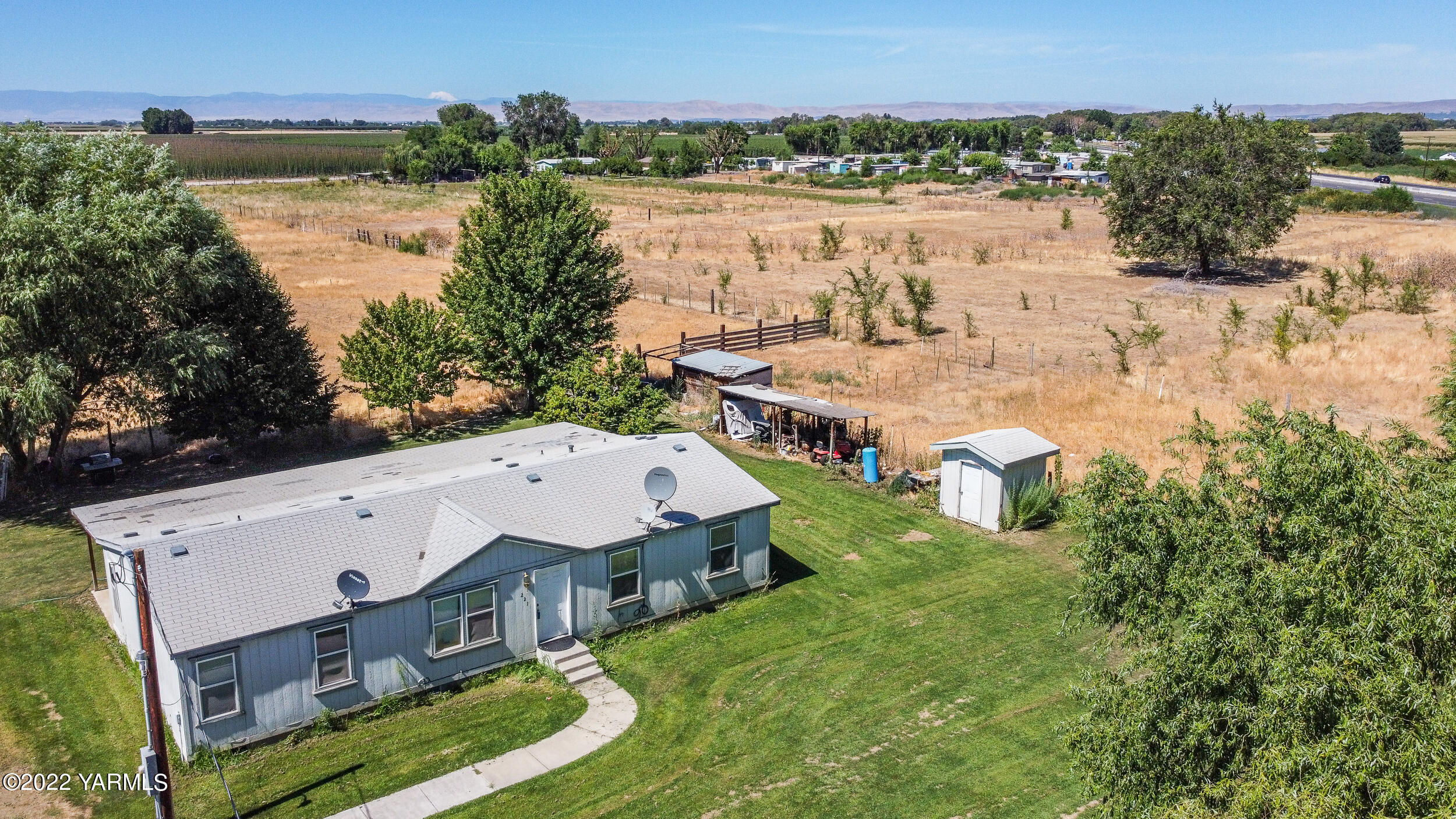 221 Rowberry Way Toppenish, WA 98948 - Photo 11 of 31 a aerial view of a house with a yard and lake view