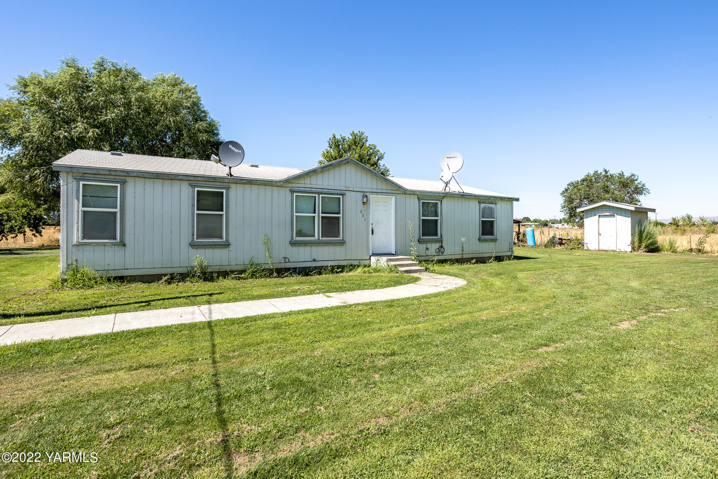 221 Rowberry Way Toppenish, WA 98948 - Photo 12 of 31 a view of a house with a yard