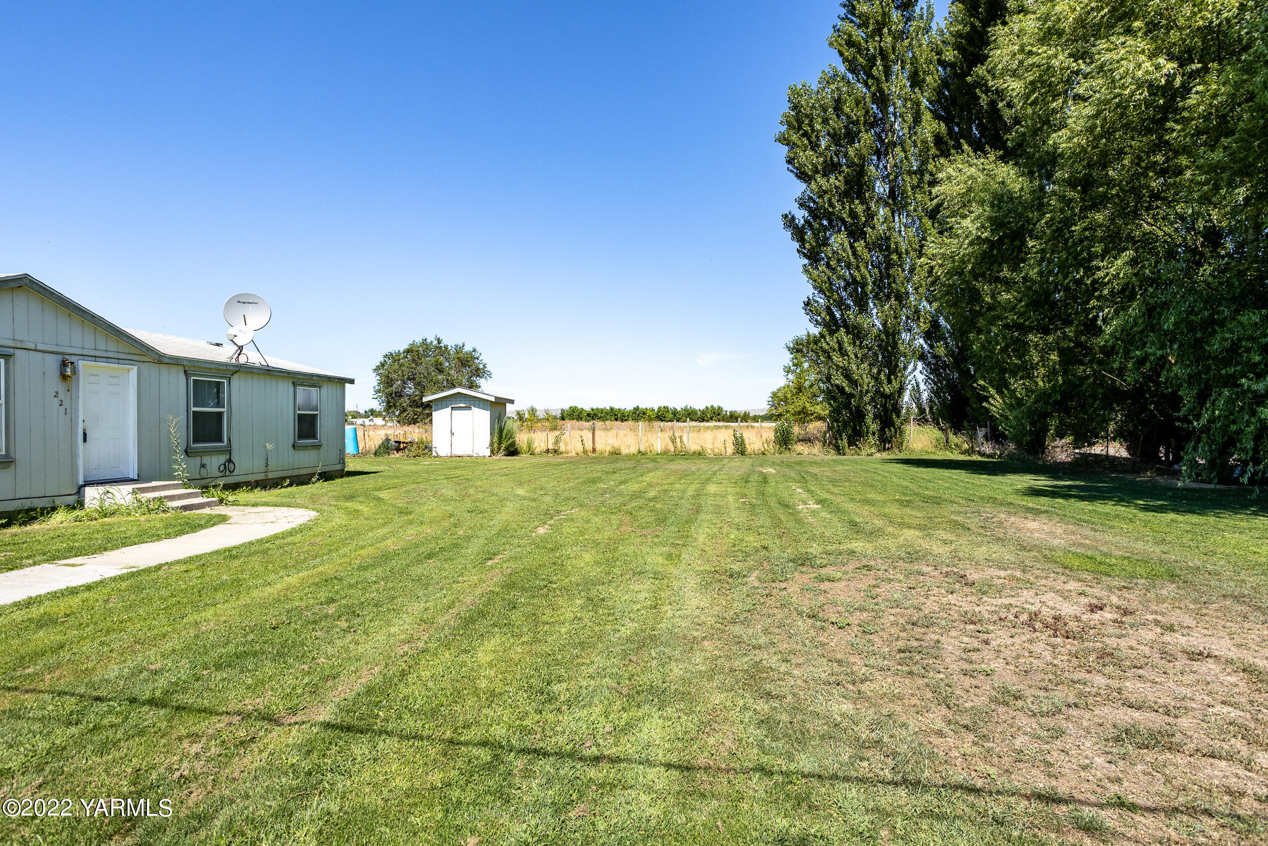 221 Rowberry Way Toppenish, WA 98948 - Photo 13 of 31 a house view with swimming pool in front of it