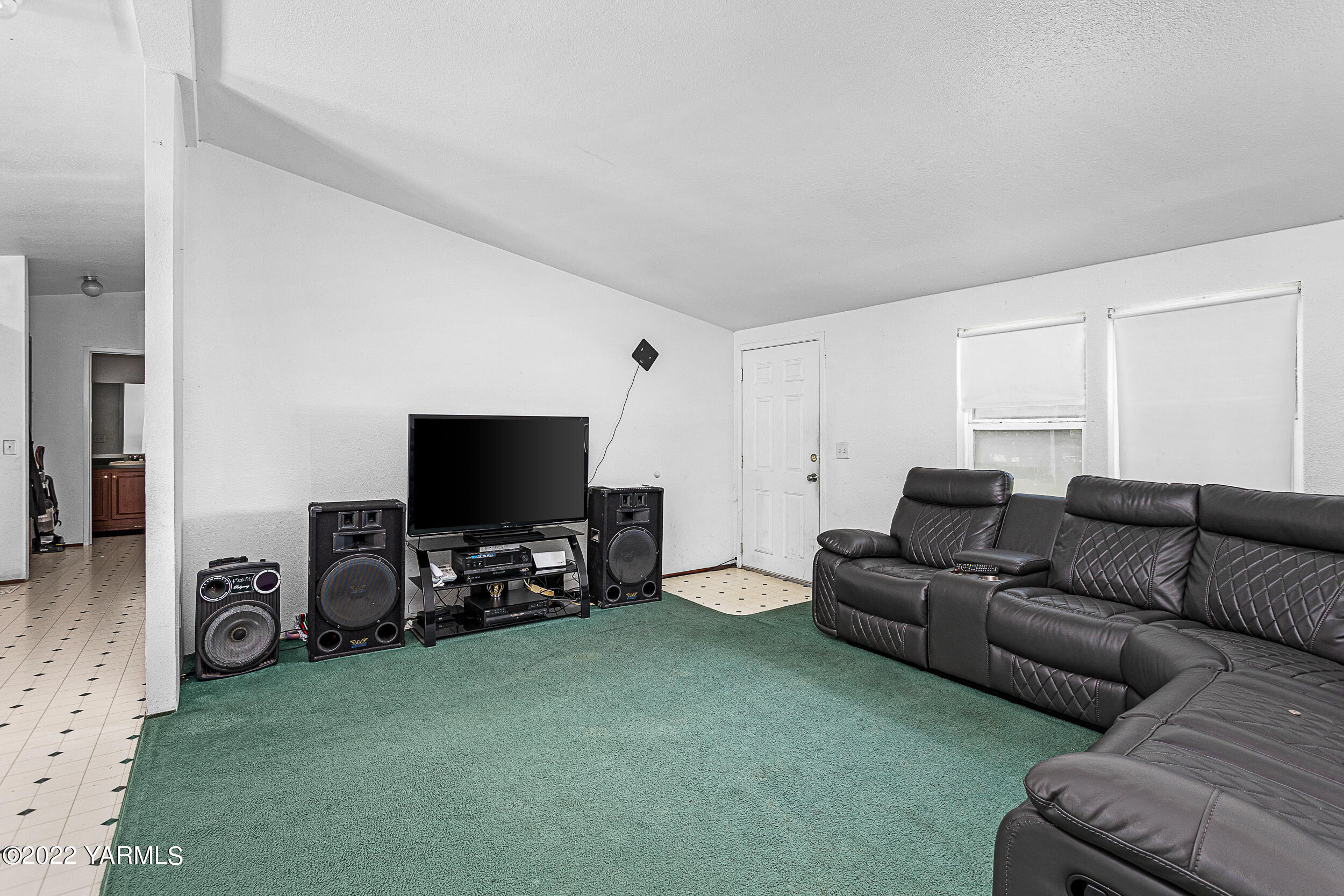 221 Rowberry Way Toppenish, WA 98948 - Photo 16 of 31 a living room with furniture and a flat screen tv