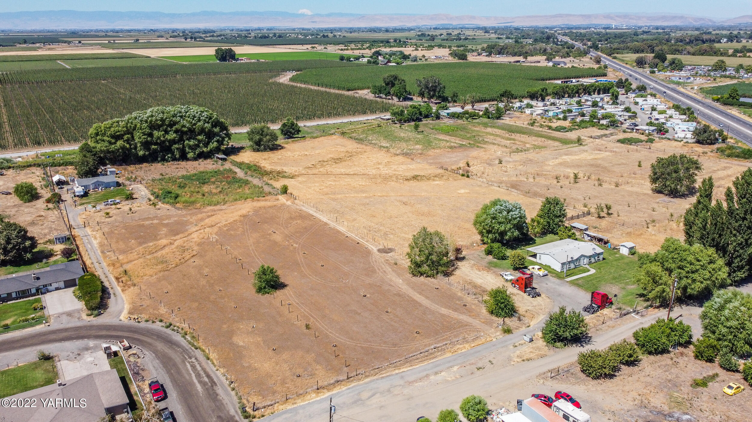 221 Rowberry Way Toppenish, WA 98948 - Photo 2 of 31 an aerial view of a house with a ocean view