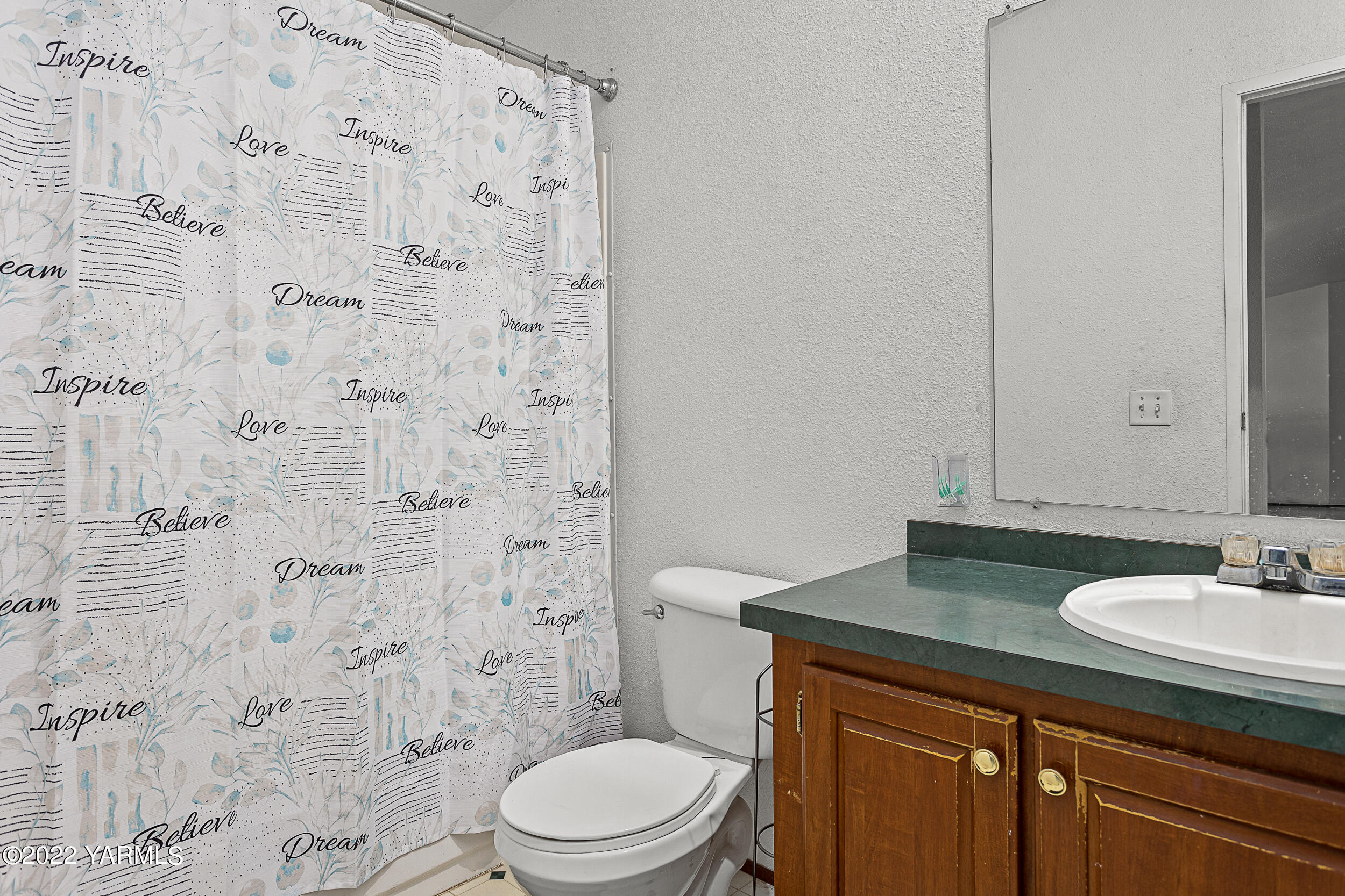 221 Rowberry Way Toppenish, WA 98948 - Photo 26 of 31 a bathroom with a granite countertop sink toilet and shower
