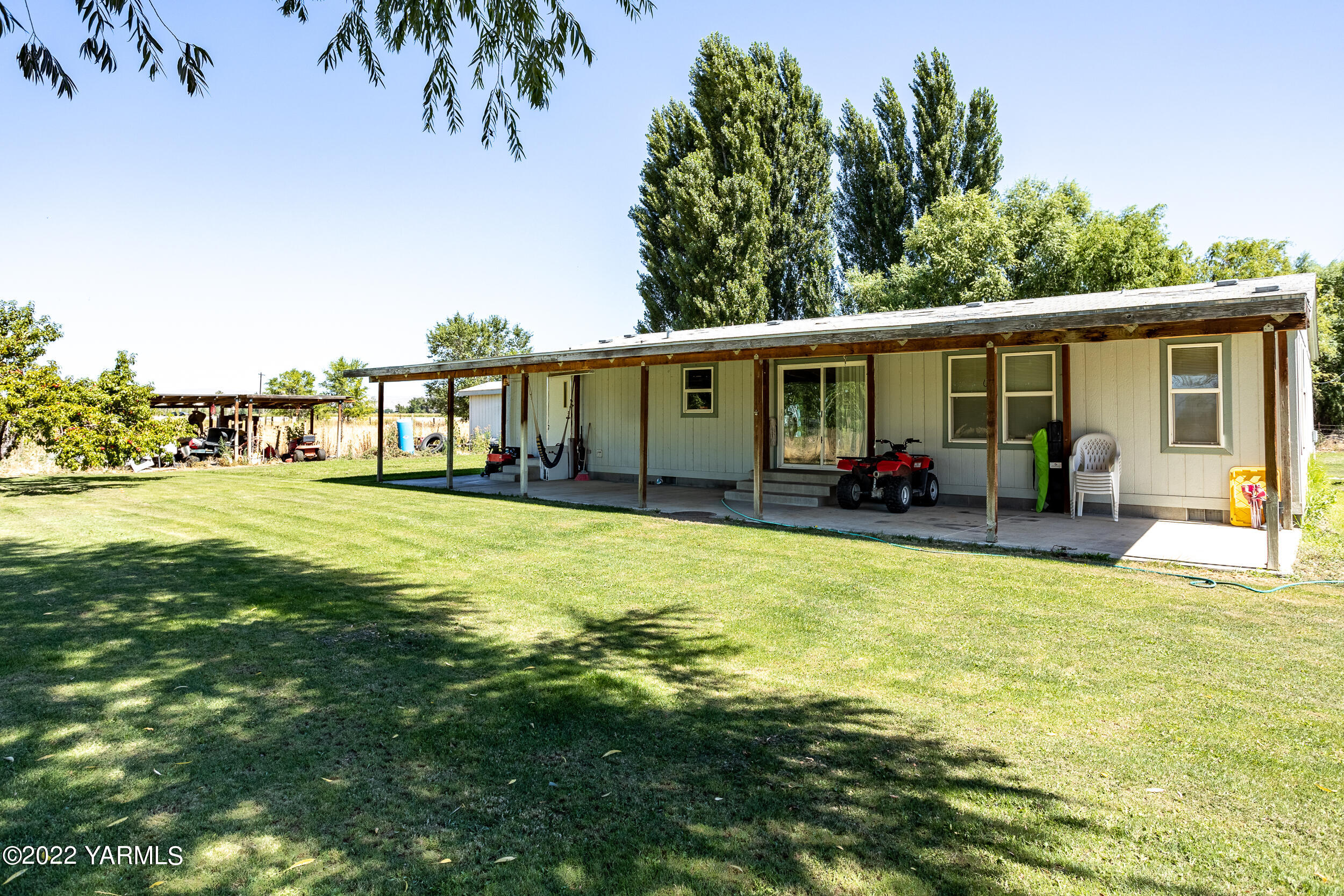 221 Rowberry Way Toppenish, WA 98948 - Photo 28 of 31 a view of a house with a swimming pool