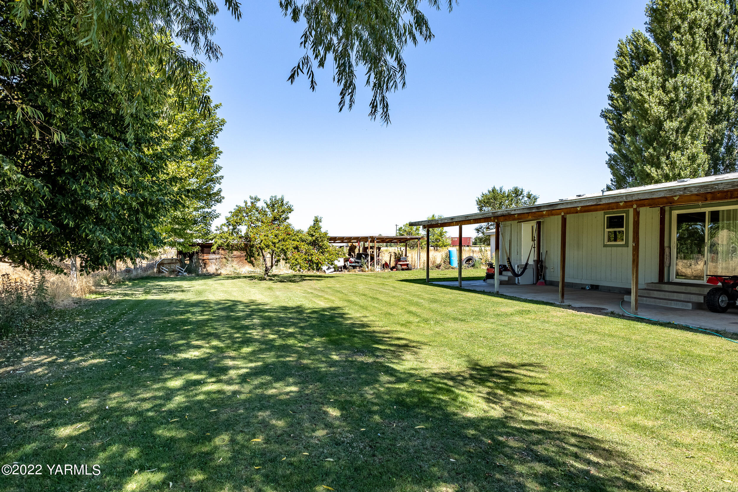 221 Rowberry Way Toppenish, WA 98948 - Photo 29 of 31 a view of a house with a big yard