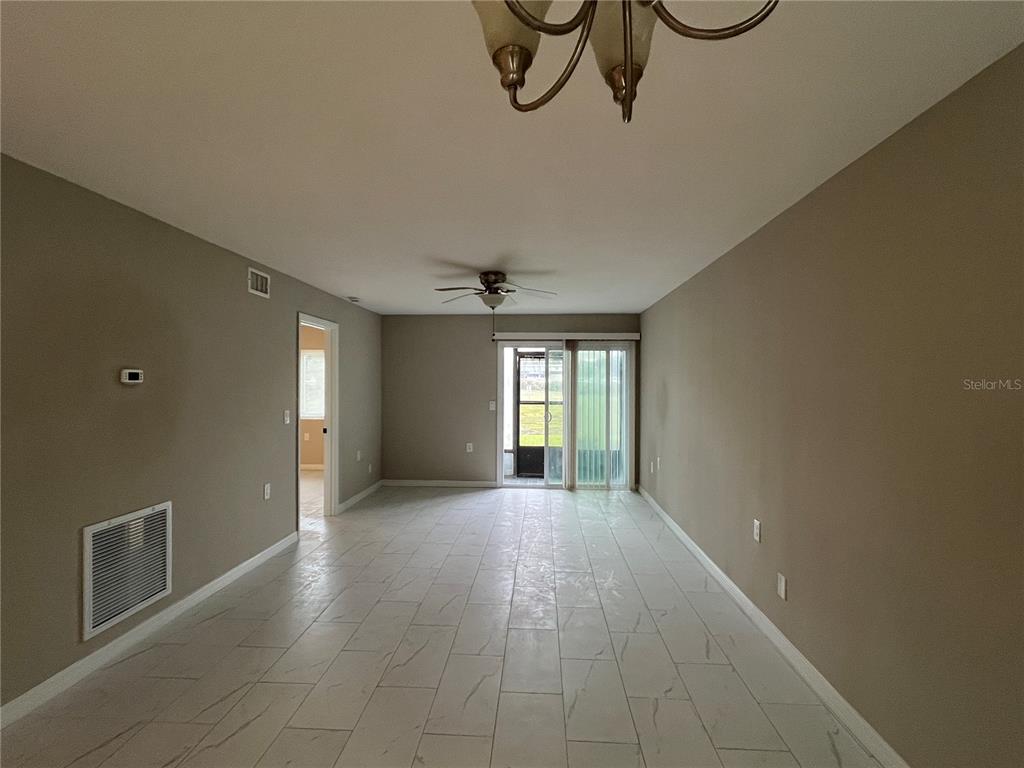 39132 County Road 54, Unit 2064 Zephyrhills, FL 33542 - Photo 6 of 20 a view of a livingroom with wooden floor and windows
