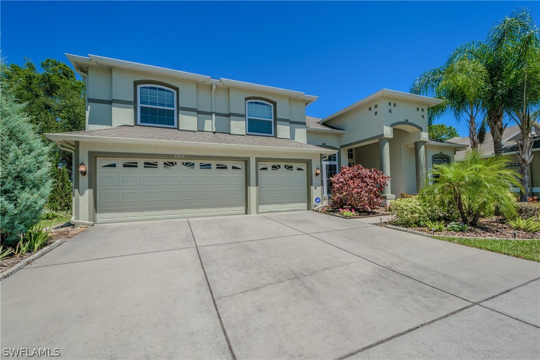 4842 Walnut Ridge Road Land O' Lakes, FL 34638 - Photo 1 of 20 front view of house with a yard
