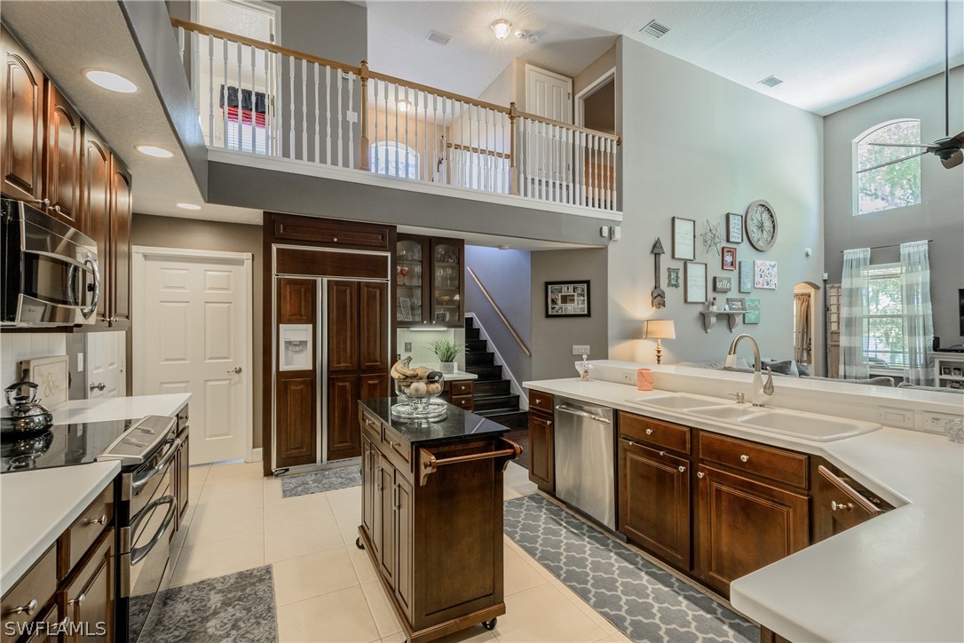 4842 Walnut Ridge Road Land O' Lakes, FL 34638 - Photo 5 of 20 a kitchen with granite countertop a stove and cabinets