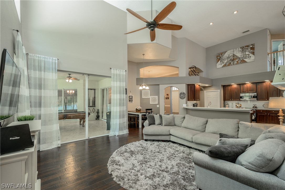 4842 Walnut Ridge Road Land O' Lakes, FL 34638 - Photo 8 of 20 a living room with furniture and wooden floor