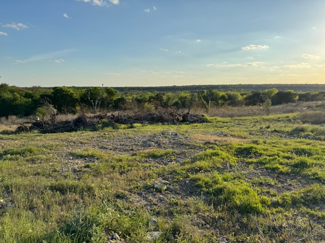 152 Bremond Road Belton, TX 76513 - Photo 2 of 5 Expansive land parcel featuring natural grasses, scattered rock, and a distant tree line