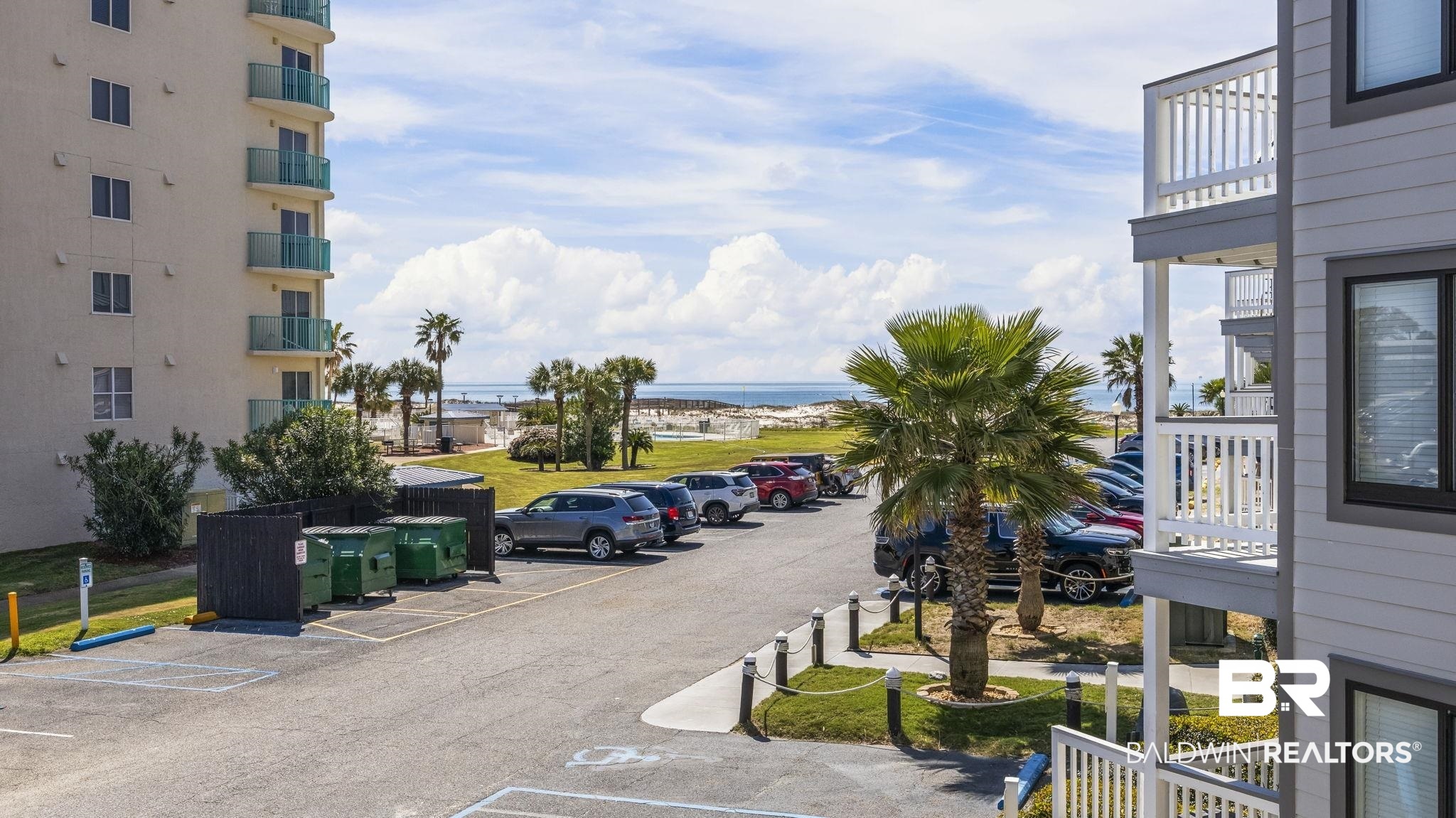 497 Plantation Road, Unit 1247 Gulf Shores, AL 36542 - Photo 19 of 29 Uncovered parking lot featuring a water view