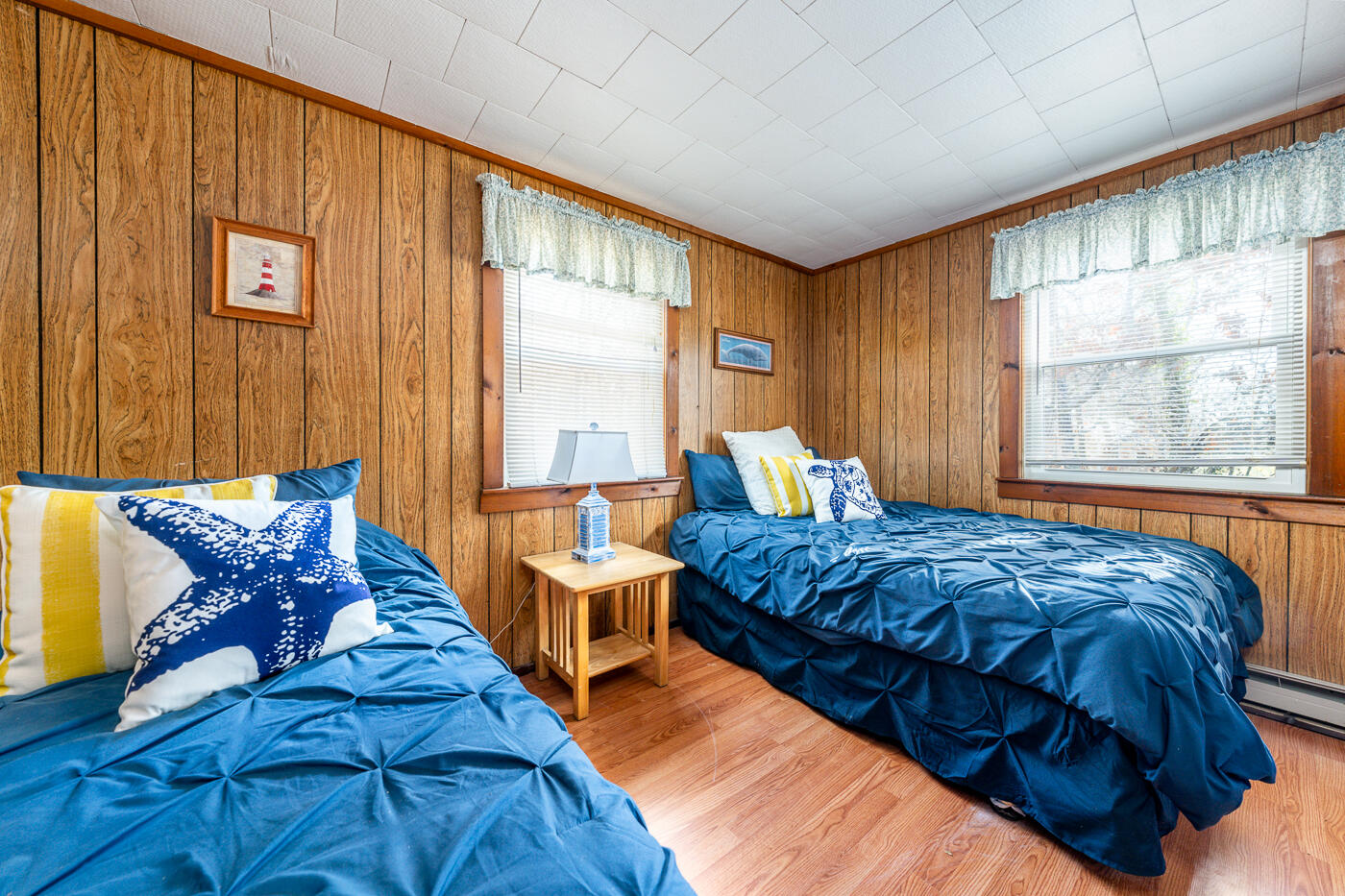 60 Long Avenue, Unit E Wellfleet, MA 02667 - Photo 11 of 22 a bed sitting in a bedroom next to a window