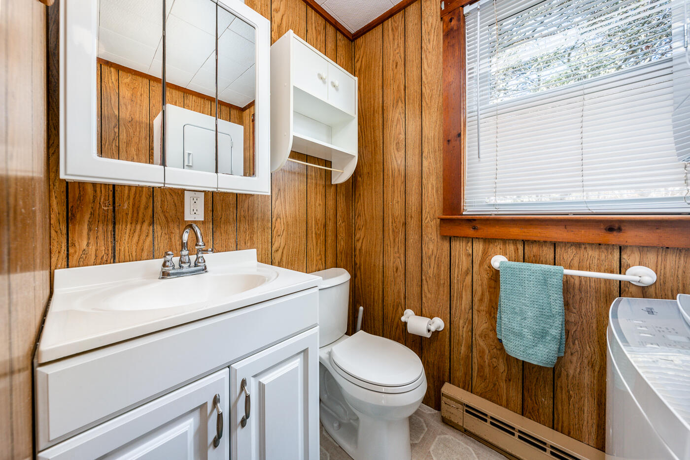60 Long Avenue, Unit E Wellfleet, MA 02667 - Photo 13 of 22 a bathroom with a sink a toilet and a mirror