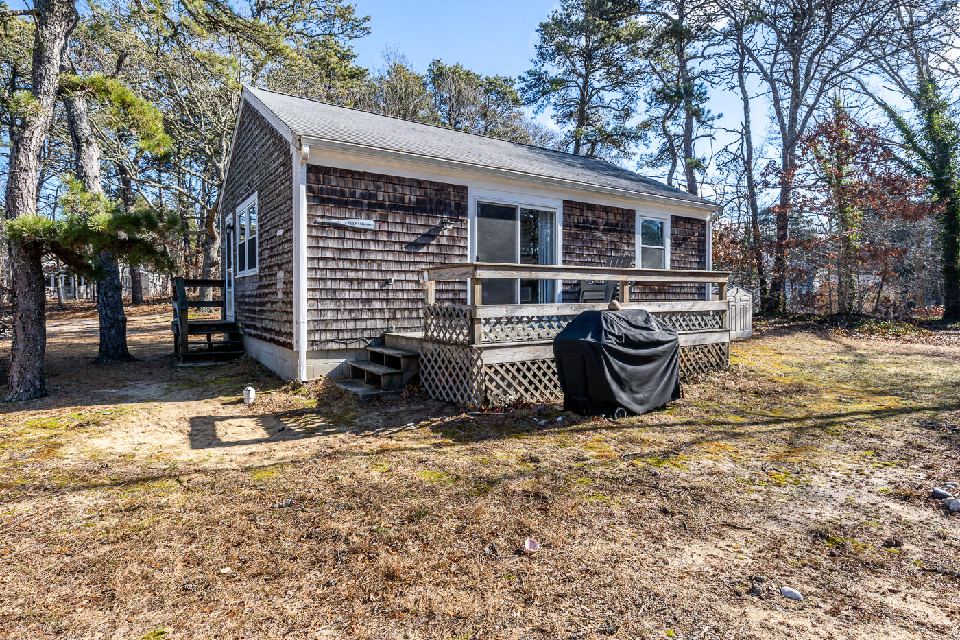 60 Long Avenue, Unit E Wellfleet, MA 02667 - Photo 15 of 22 a view of a house with a yard