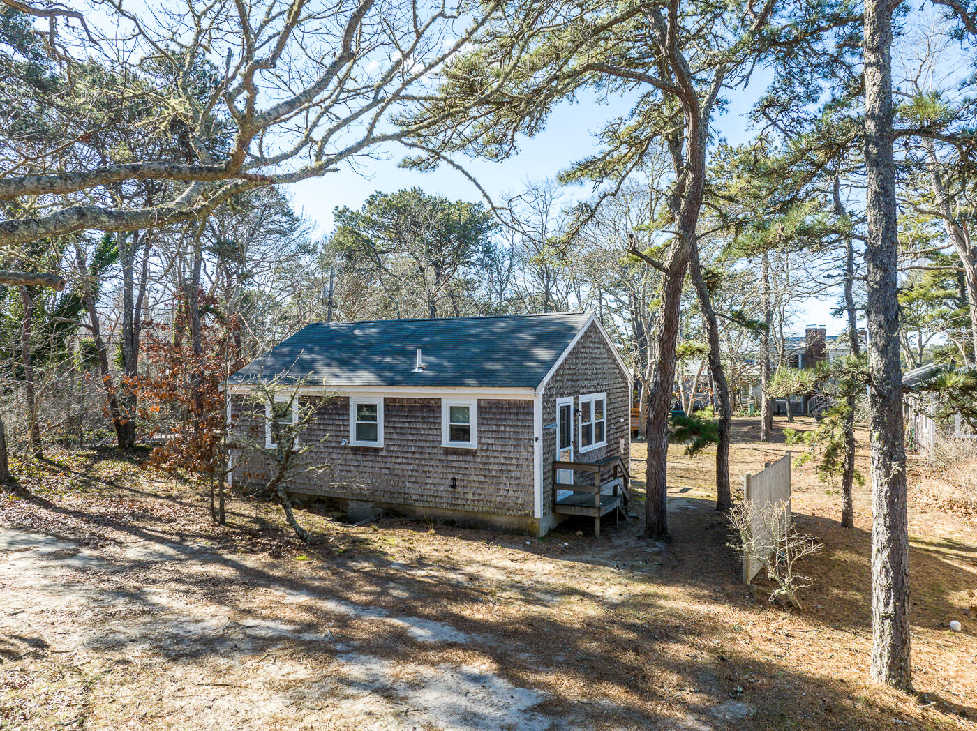 60 Long Avenue, Unit E Wellfleet, MA 02667 - Photo 2 of 22 a view of a house with a yard