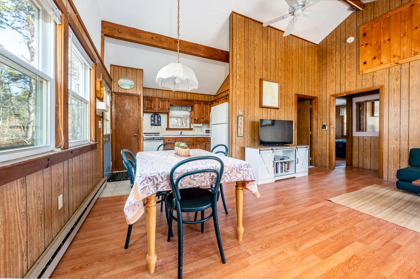 60 Long Avenue, Unit E Wellfleet, MA 02667 - Photo 6 of 22 a dining room with furniture and wooden floor