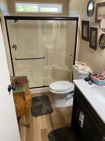 a room with patio furniture and a potted plant